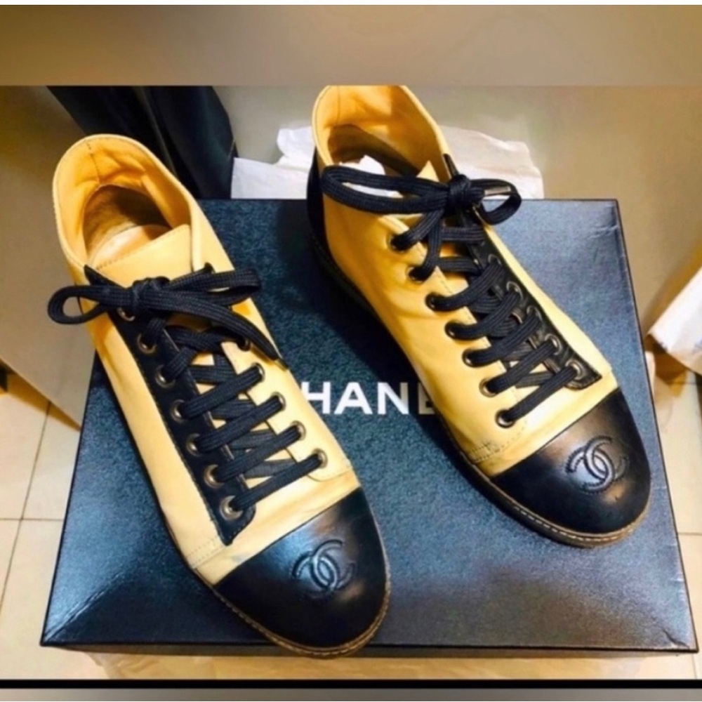 CHANEL women’s Black and Cream Sneakers